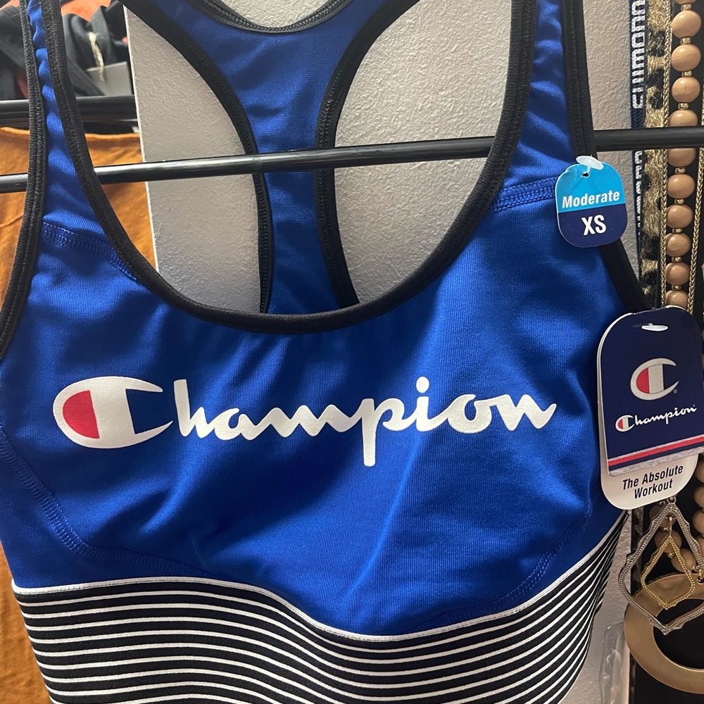Champion sports bra. Blue with black and white stripes, size XS. New with tags!